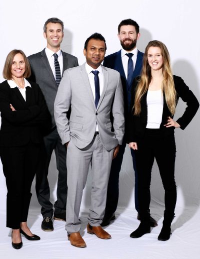 group of people in suits having a studio business portrait