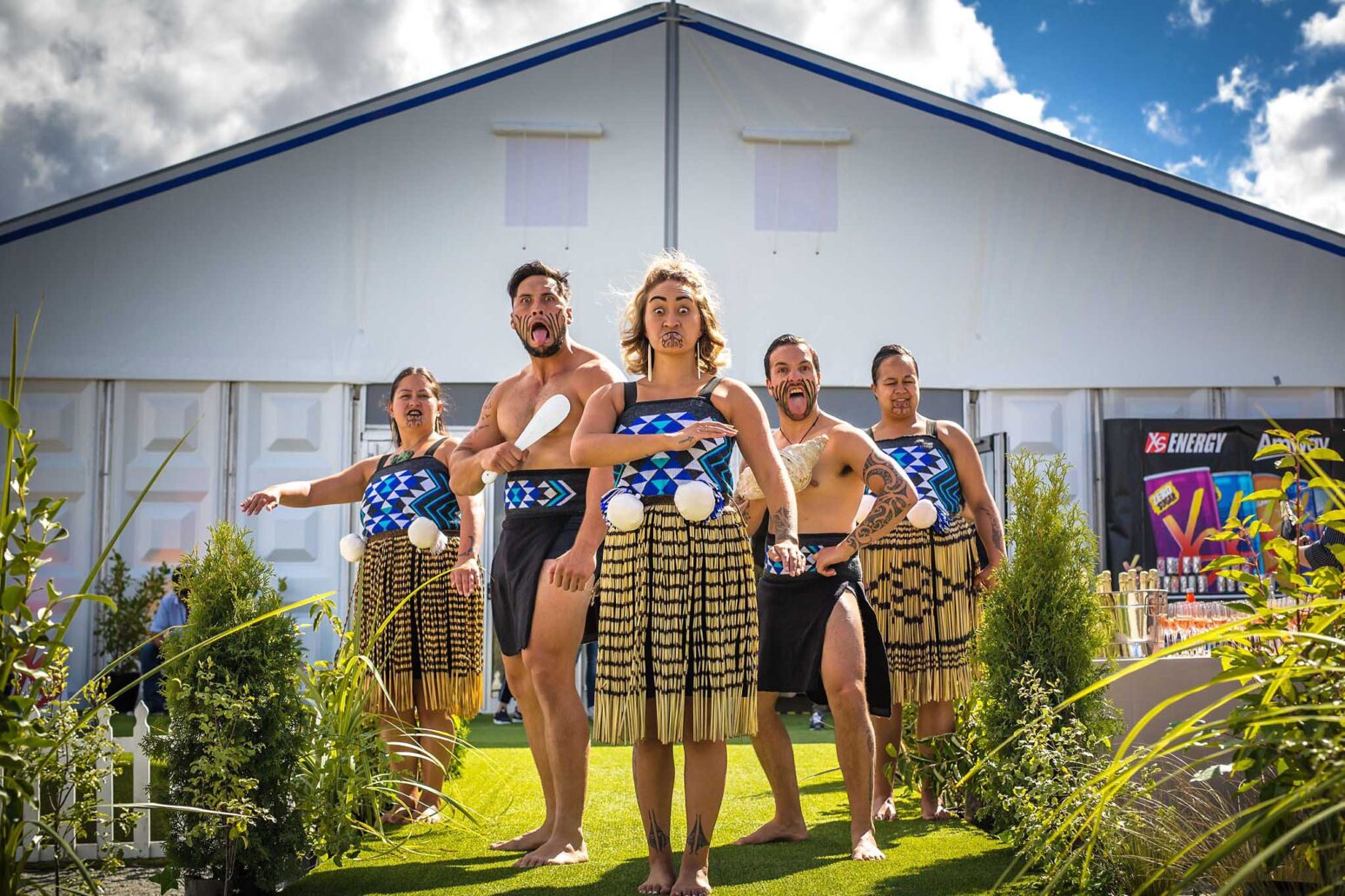 5 male & female New Zealand Maori's in traditional attire