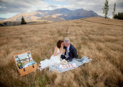 bride and groom having picnic