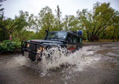 4wd vehicle driving through river