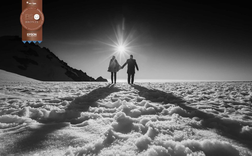 couple holding hands on snow