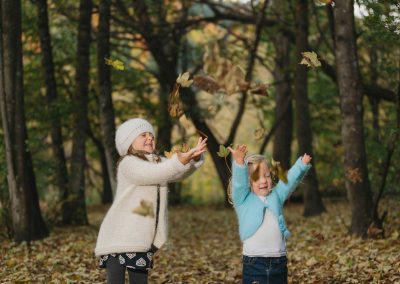 kids playing with leaves