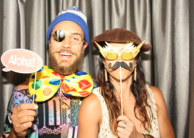 photo booth image of couple with props