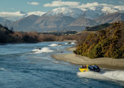 Yellow jet boats on river