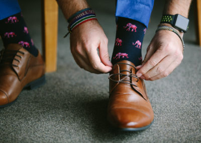 groom tying his shoes