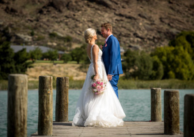 Bride and groom on pier in Cromwell