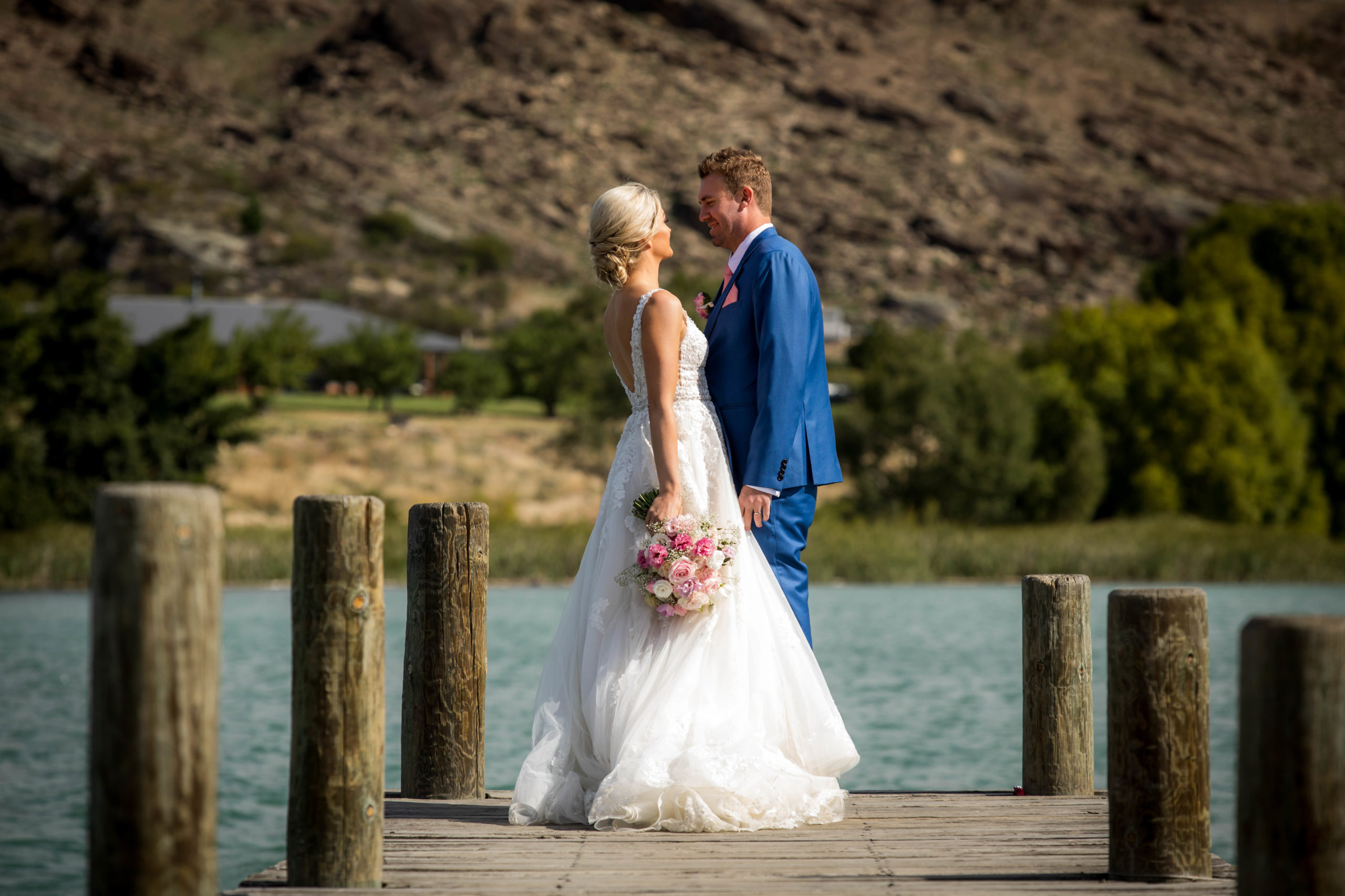 Bride and groom on pier in Cromwell