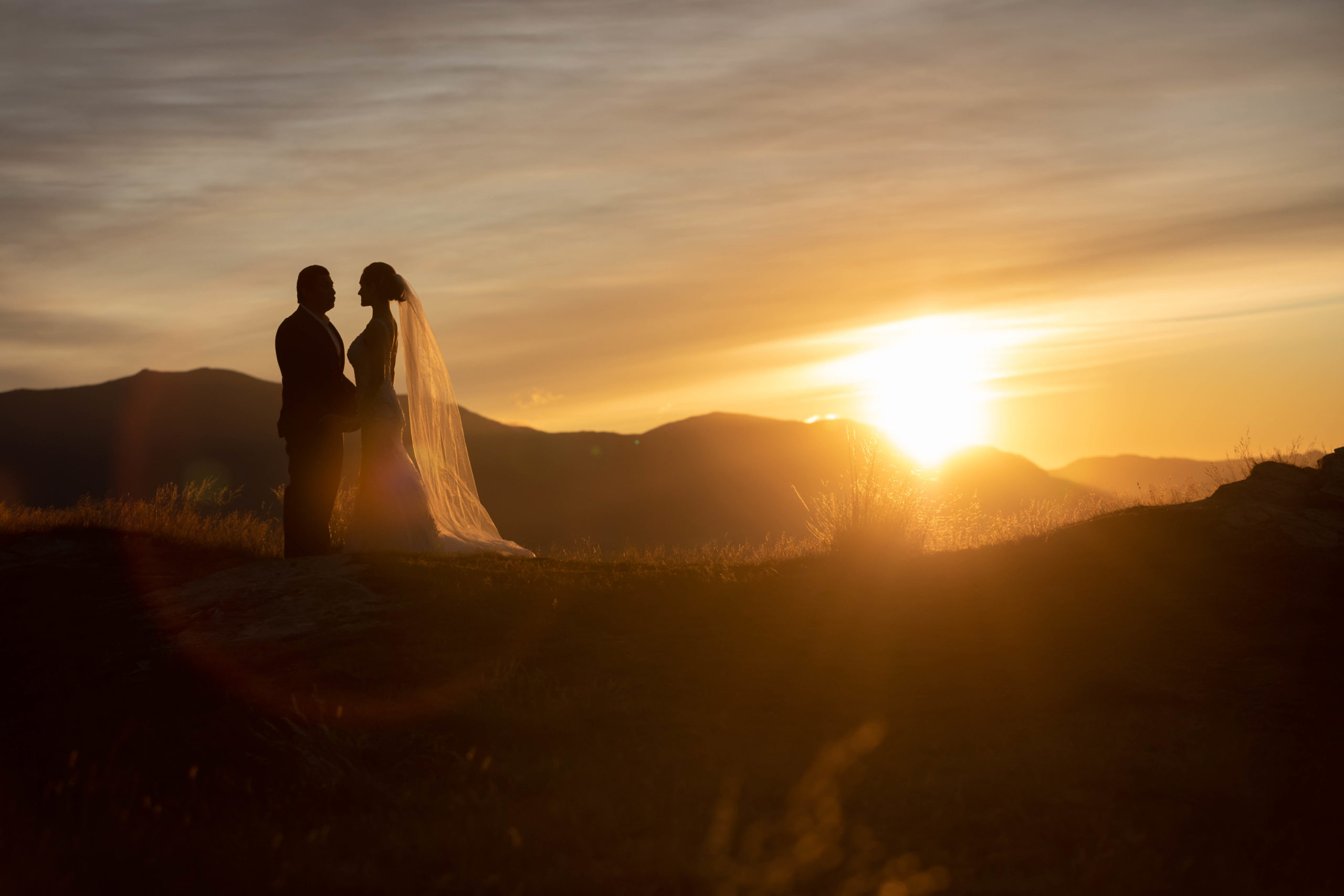 Bride and groom with sunrise in Queenstown