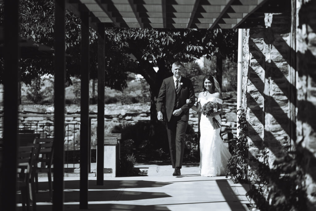 Bride and father walking down aisle