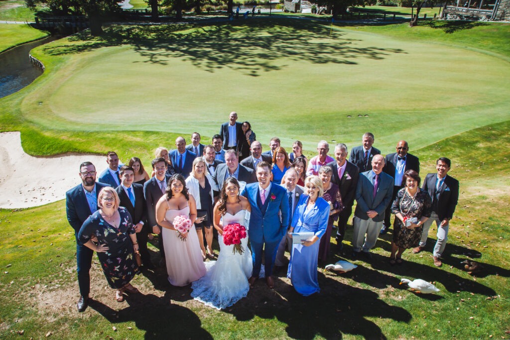 wedding big group photo on golf course