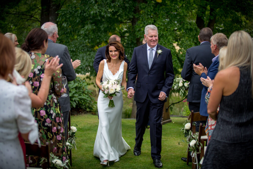 Bride and groom walking down the aisle