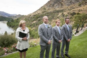 Grooms men and celebrant waiting