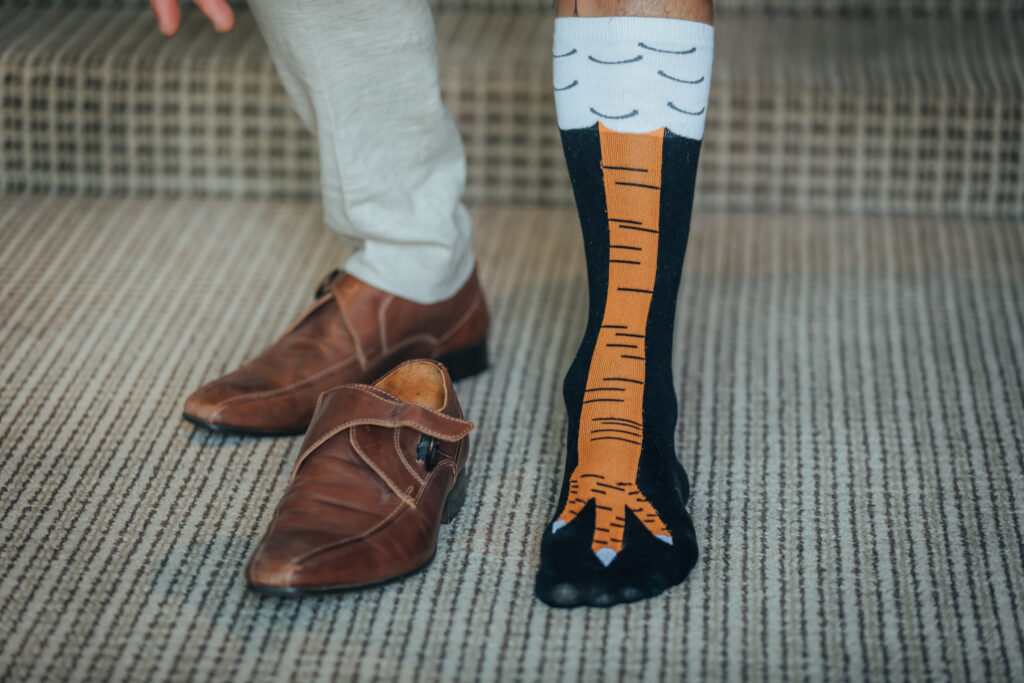 groom with chicken socks on