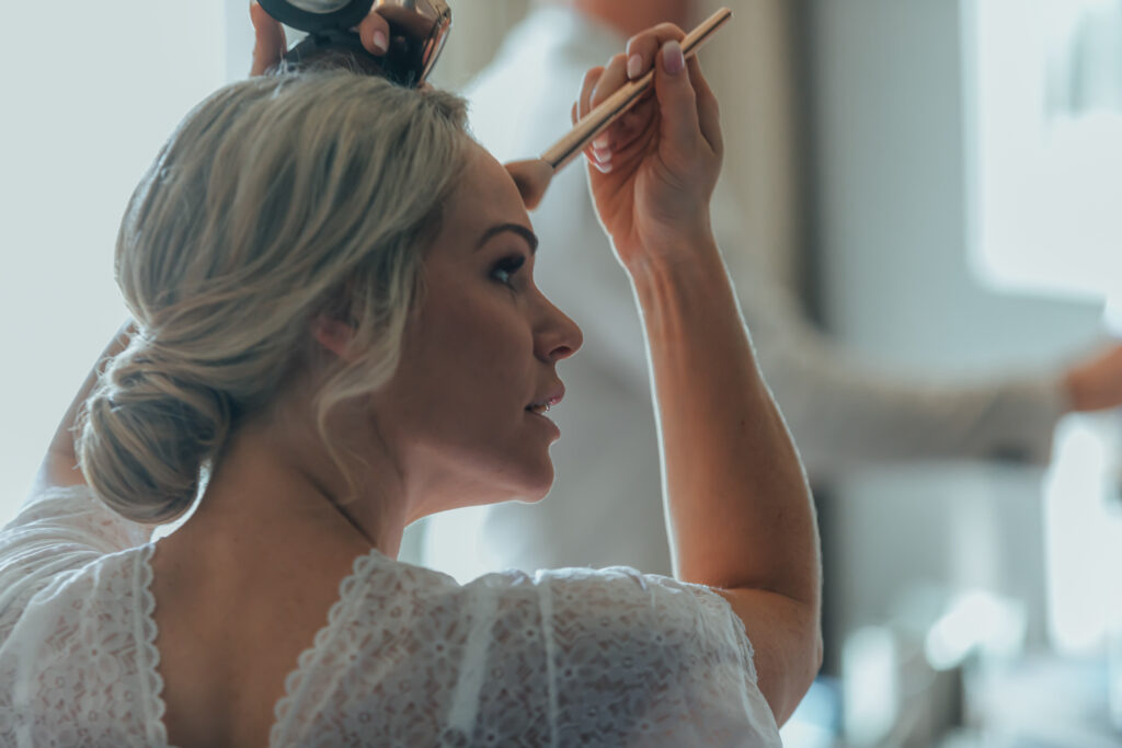 bride doing make up
