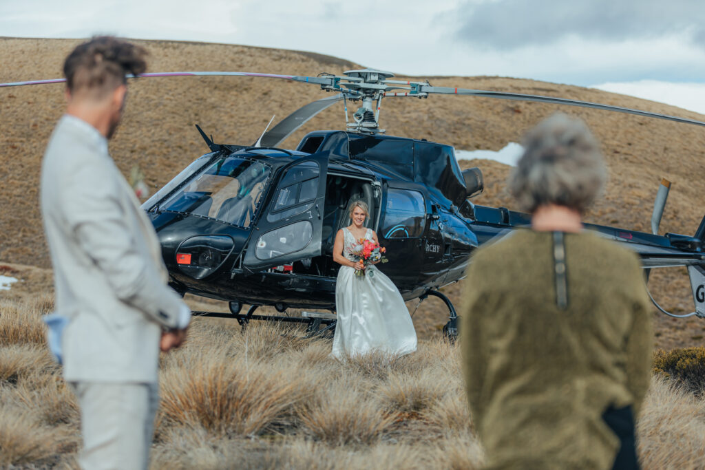 Bride in front of helicopter