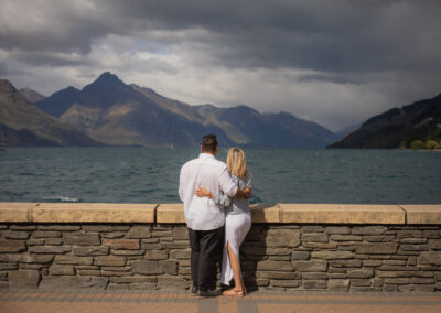 couple hugging looking out over lake