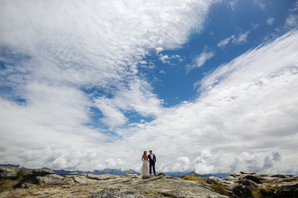 bride and groom on mountain