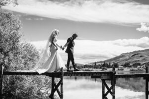 bride and groom on jetty