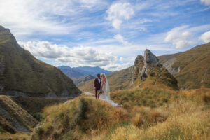 bride and groom in amongst mountains