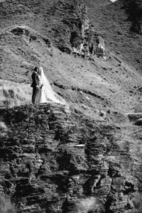 bride and groom on mountain