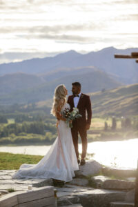 bride and groom looking at each other at sunset