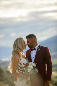 bride and groom looking at each other at sunset