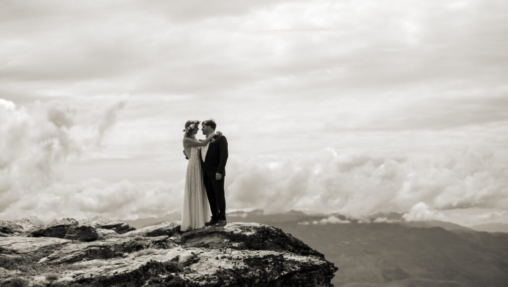 bride and groom on mountain