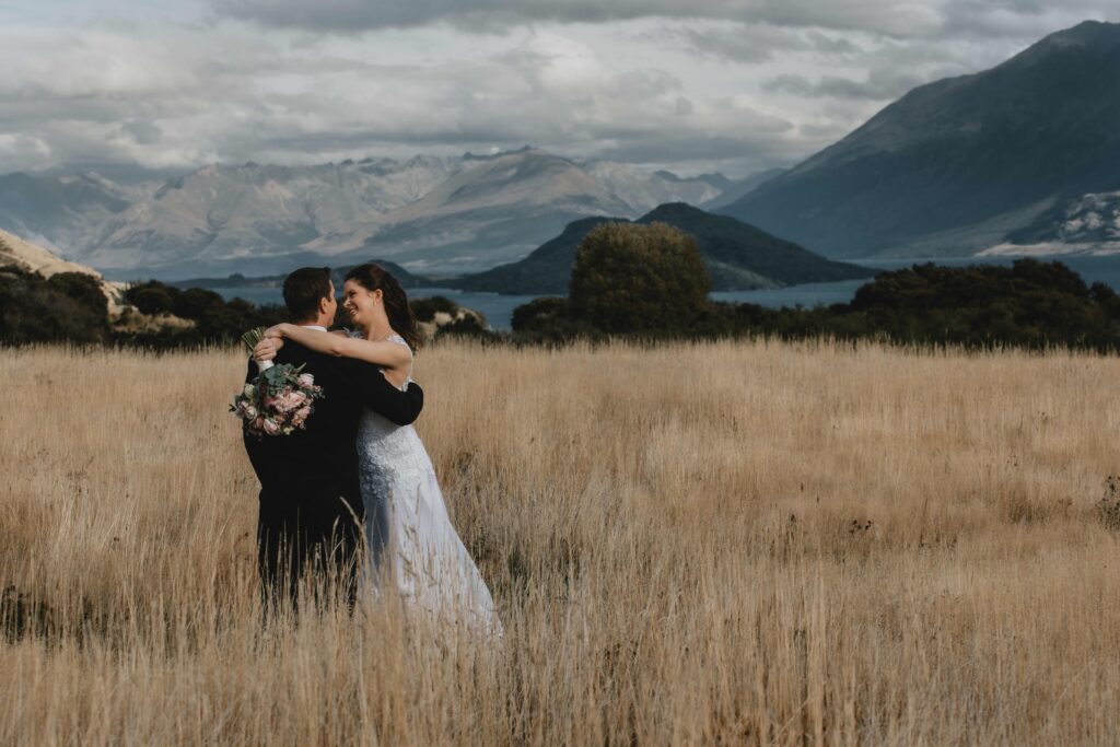 bride and groom in field